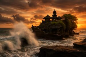 Pura Tanah Lot di Bali saat air pasang dengan ombak menghantam bebatuan dan langit senja.